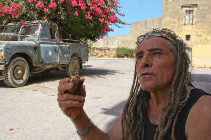 A Gozitan farmer, Gianni, eats his lunch in the shade